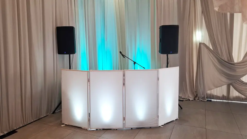 DJ Booth with white facade for wedding reception